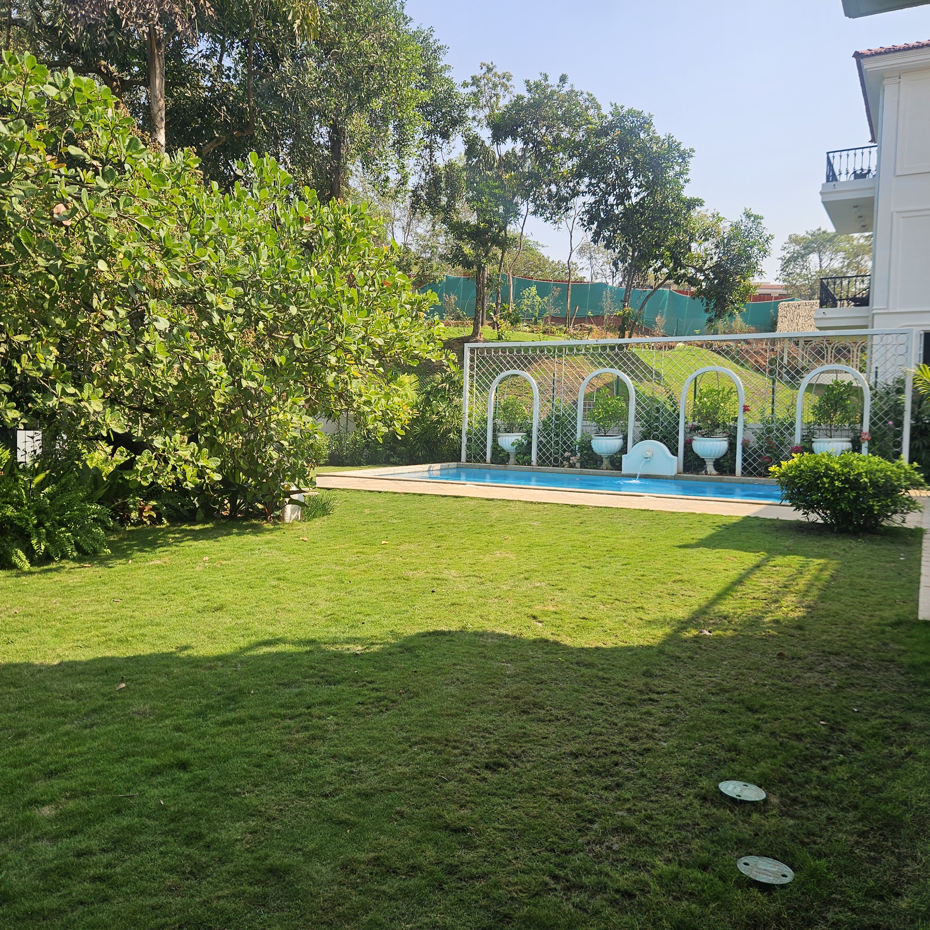 Tropical landscape design at Siolim Isprava villa with curated garden elements
